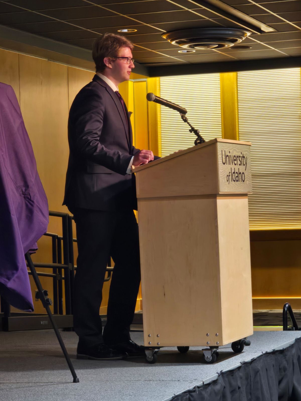 Mason Benoit speaking at University of Idaho podium